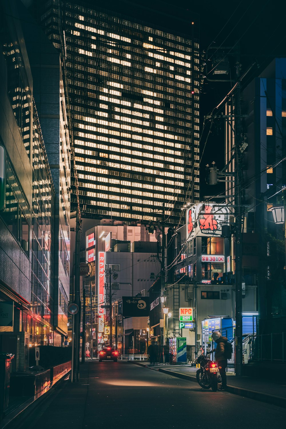 a city street filled with lots of tall buildings