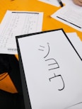 A student practicing Japanese conversation with a tutor.