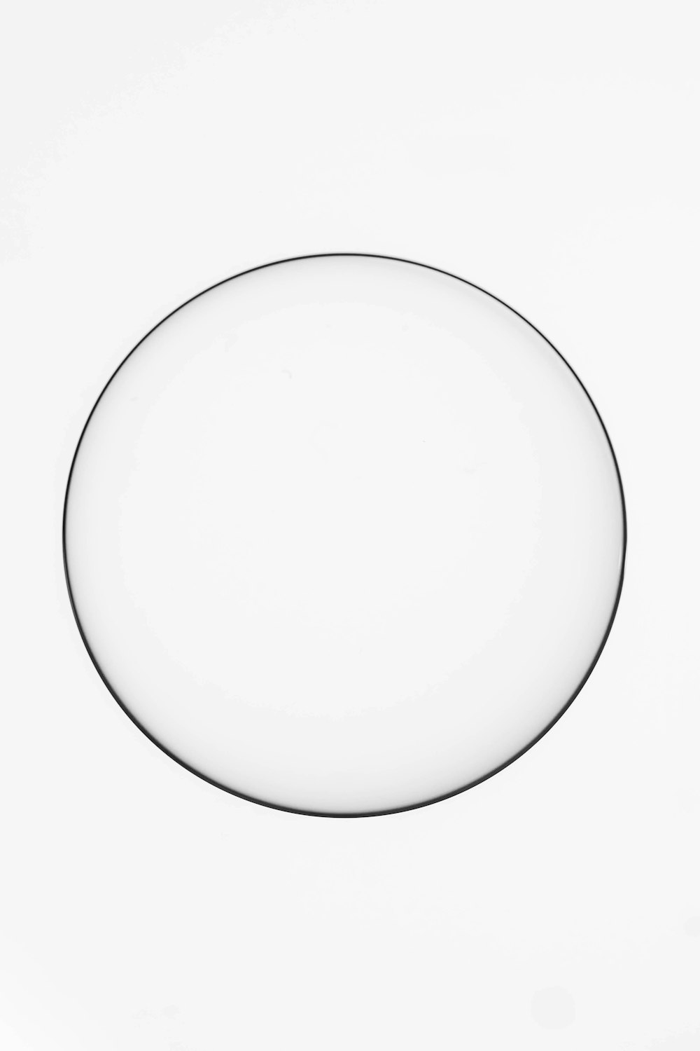 a glass plate sitting on top of a white table