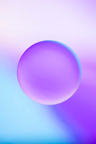 A glowing neon gradient sphere floating against a deep violet-to-black background with subtle glassmorphism blur.