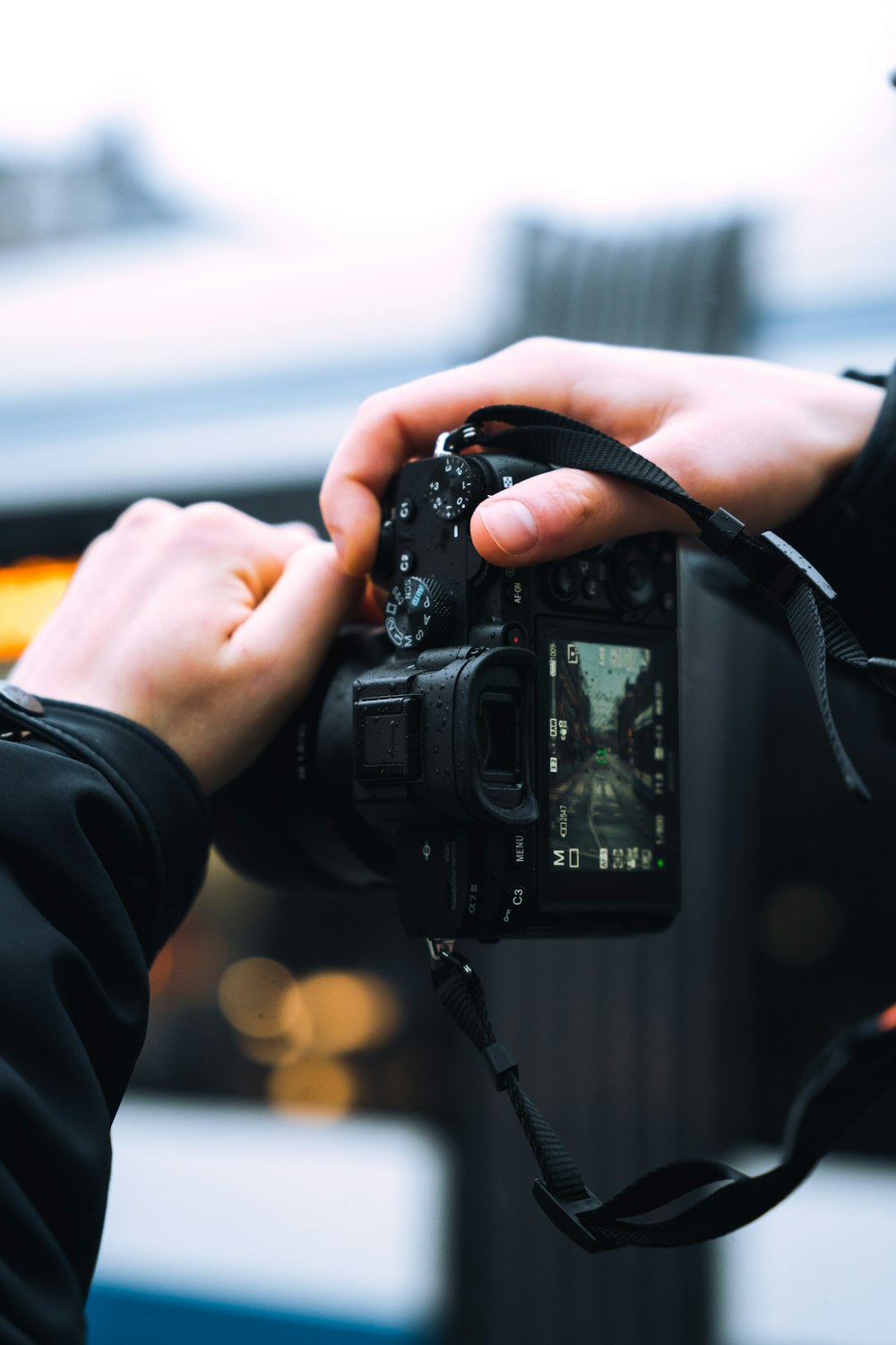 a hand holding a camera