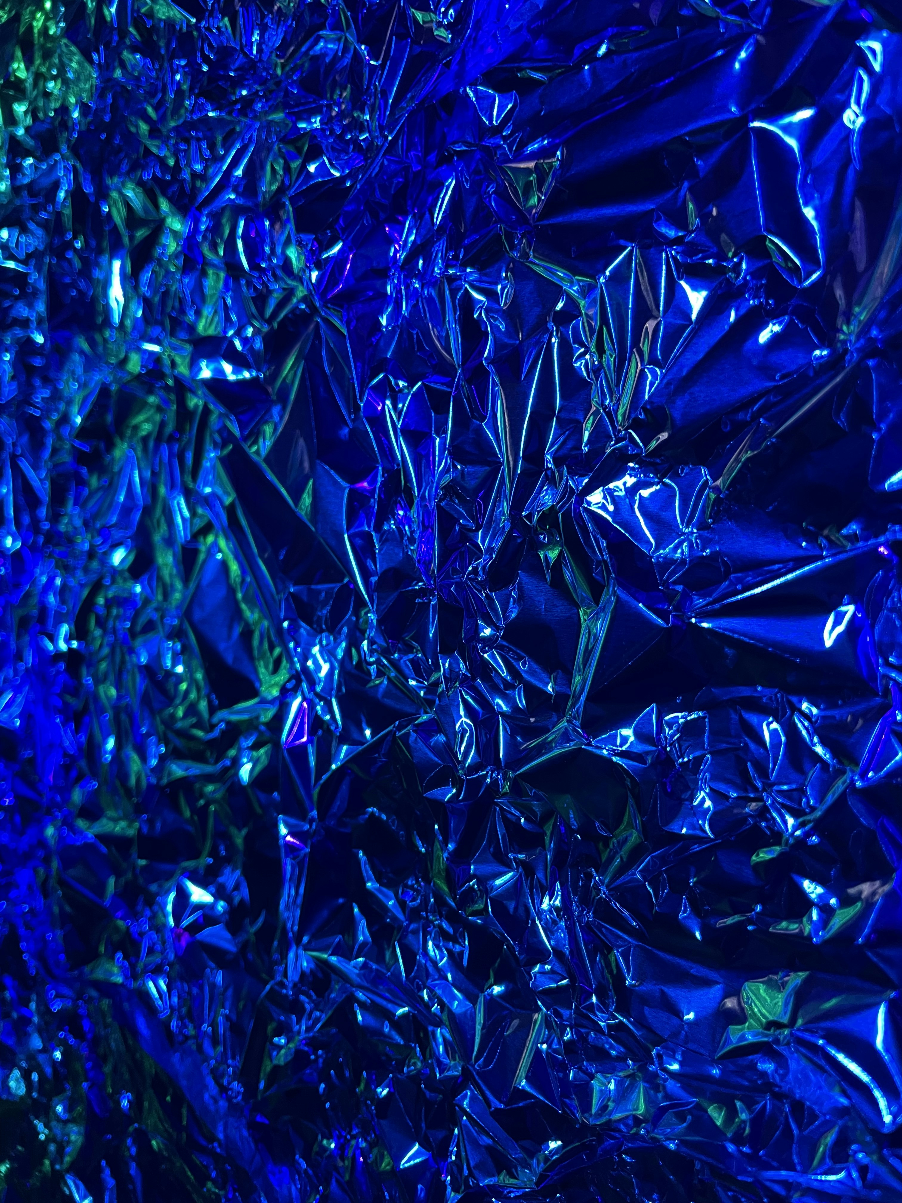 a close up of a shiny blue surface