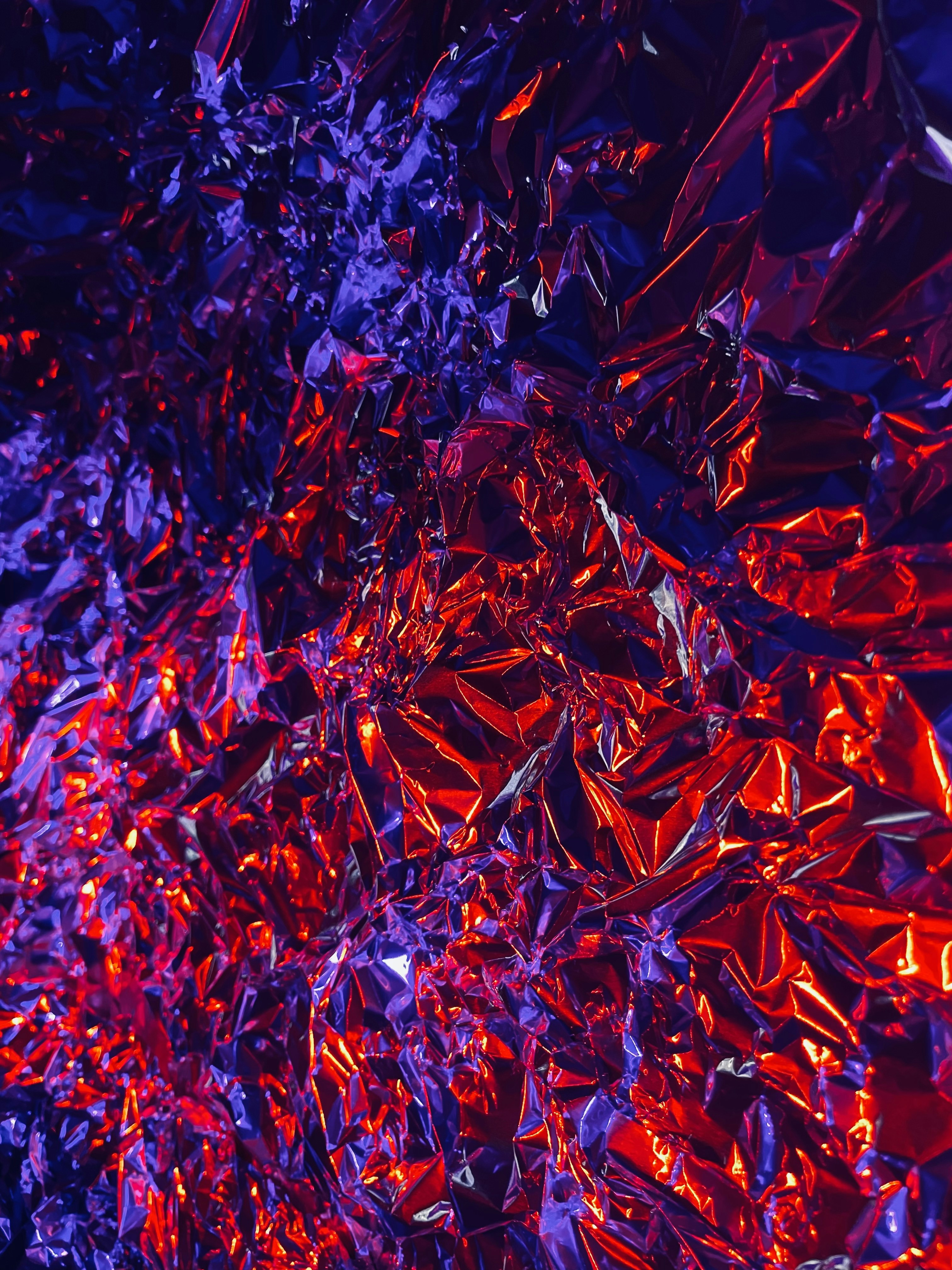 a close up of a red and purple background