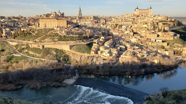 The skyline across the river, the cathedral spire and the Alcázar — Toledo, Spain