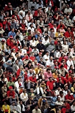 a crowd of people watching a tennis match