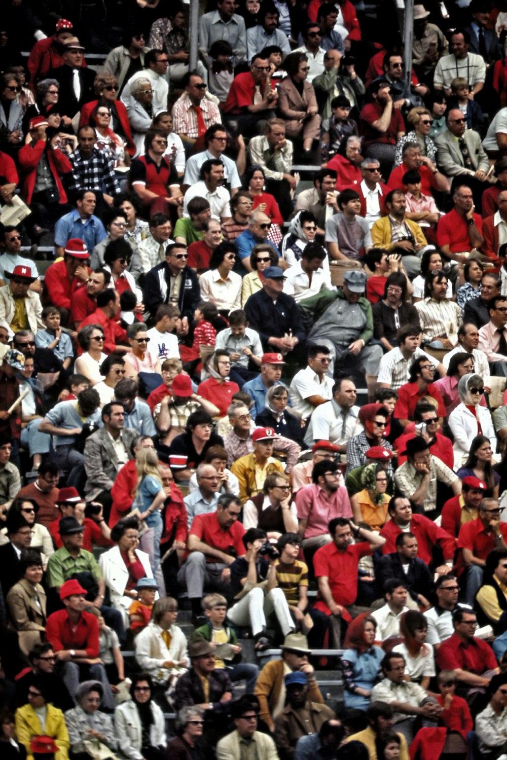 a crowd of people watching a tennis match