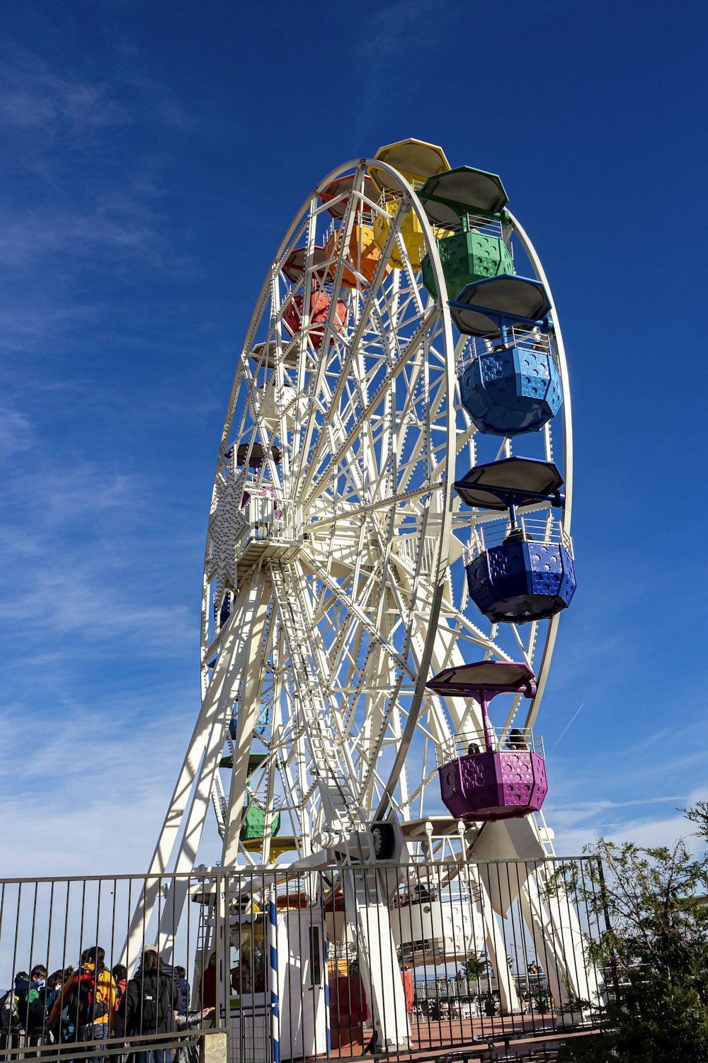a ferris wheel with a lot of colorful bags on it