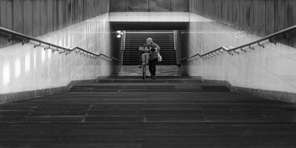 a woman walking down a flight of stairs