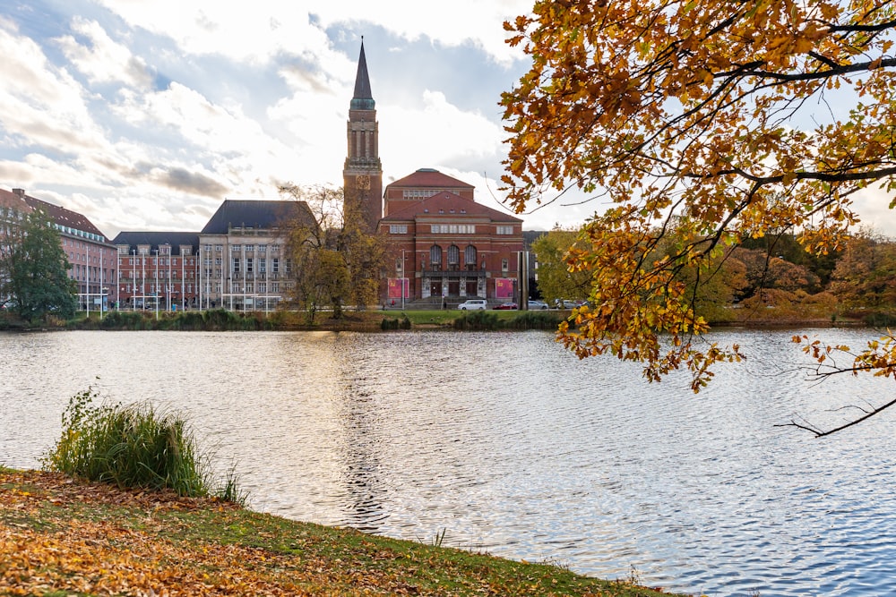 a view of a lake with a church in the background