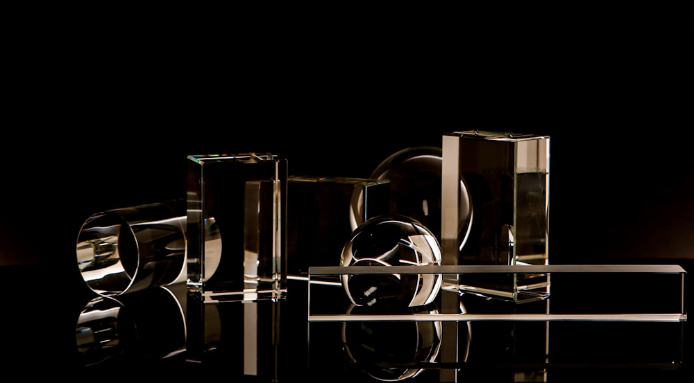 a group of glass objects sitting on top of a table