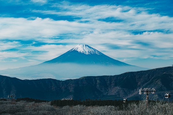 A mountain with a snow capped peak in the distance — Hakone, Japan