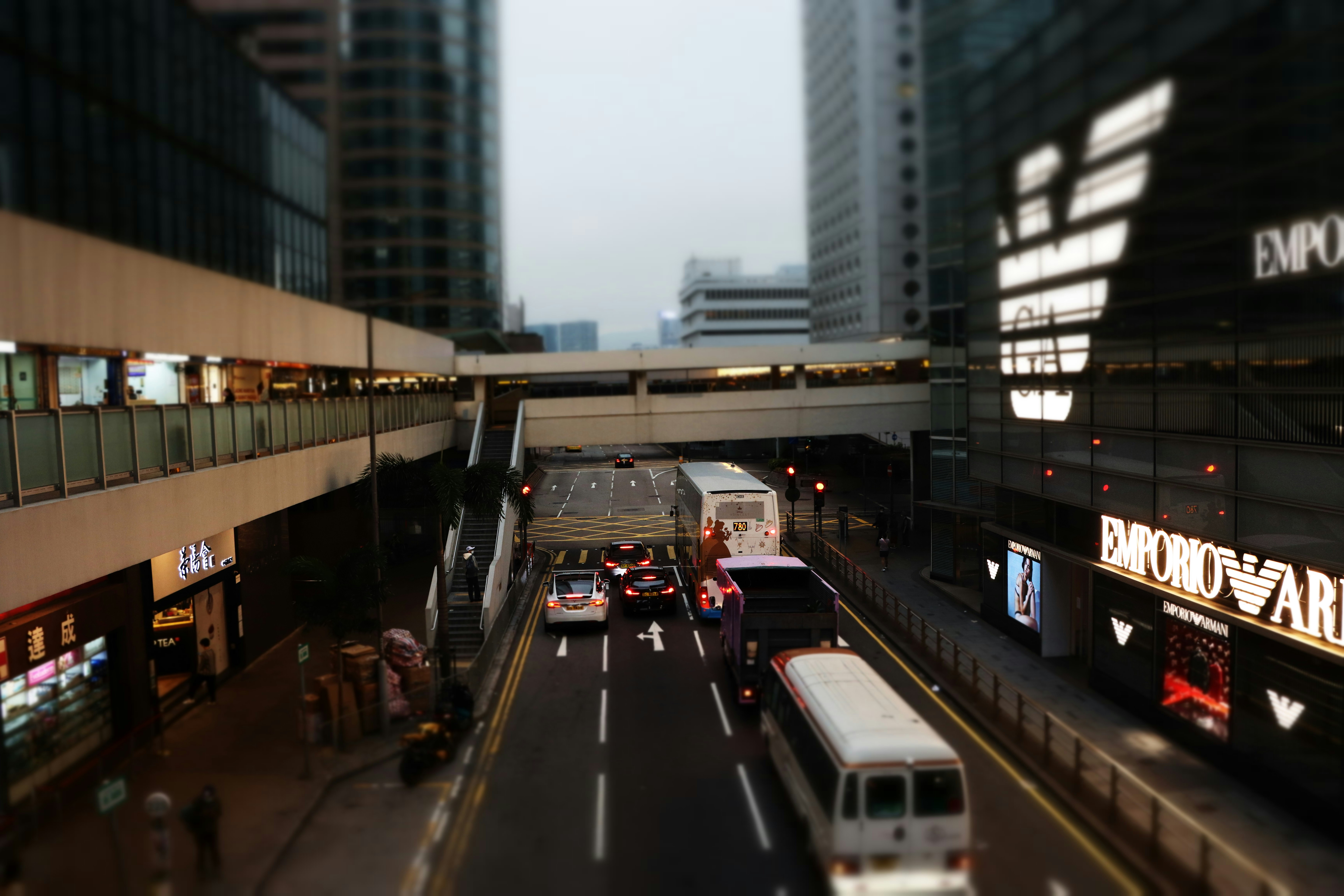 A city street filled with traffic next to tall buildings photo – Free ...