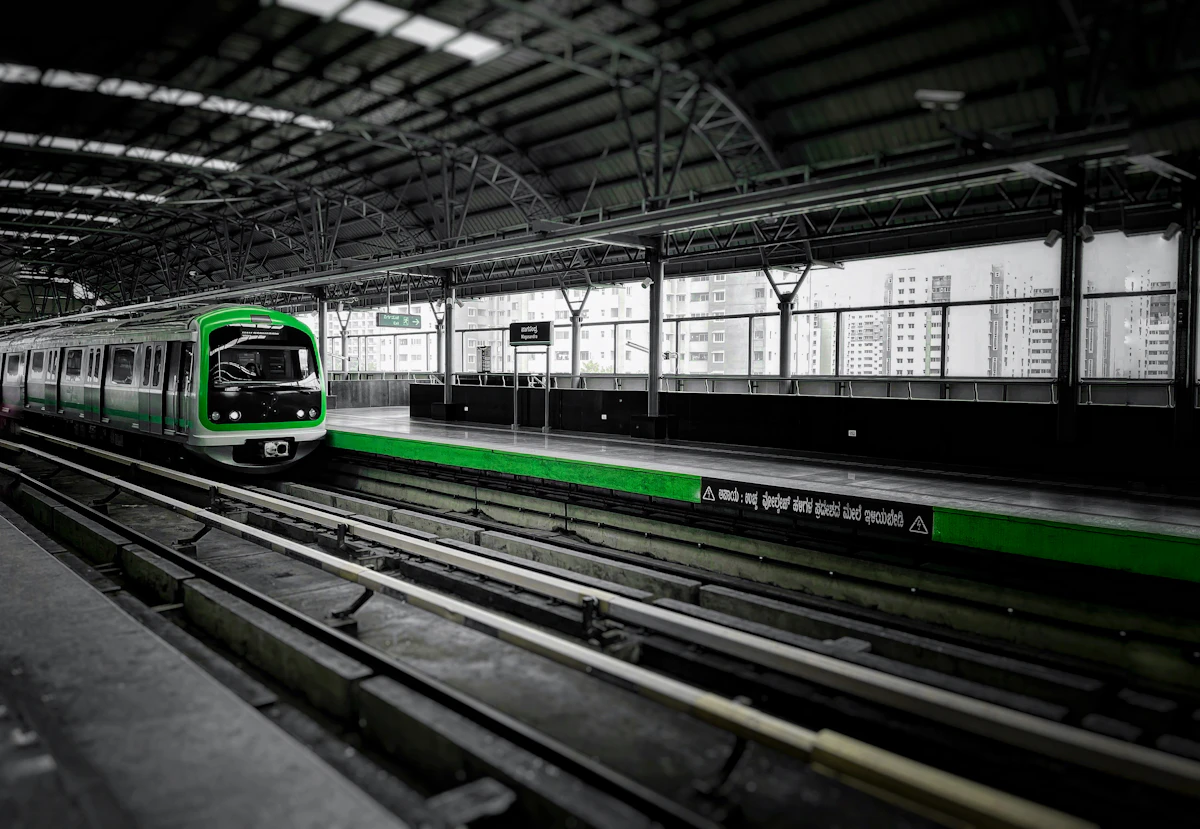 A metro train pulling into a station in India