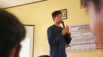 a man standing in front of a microphone