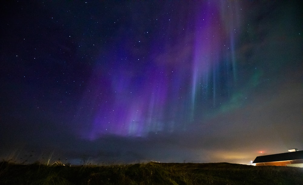 the aurora lights shine brightly in the night sky