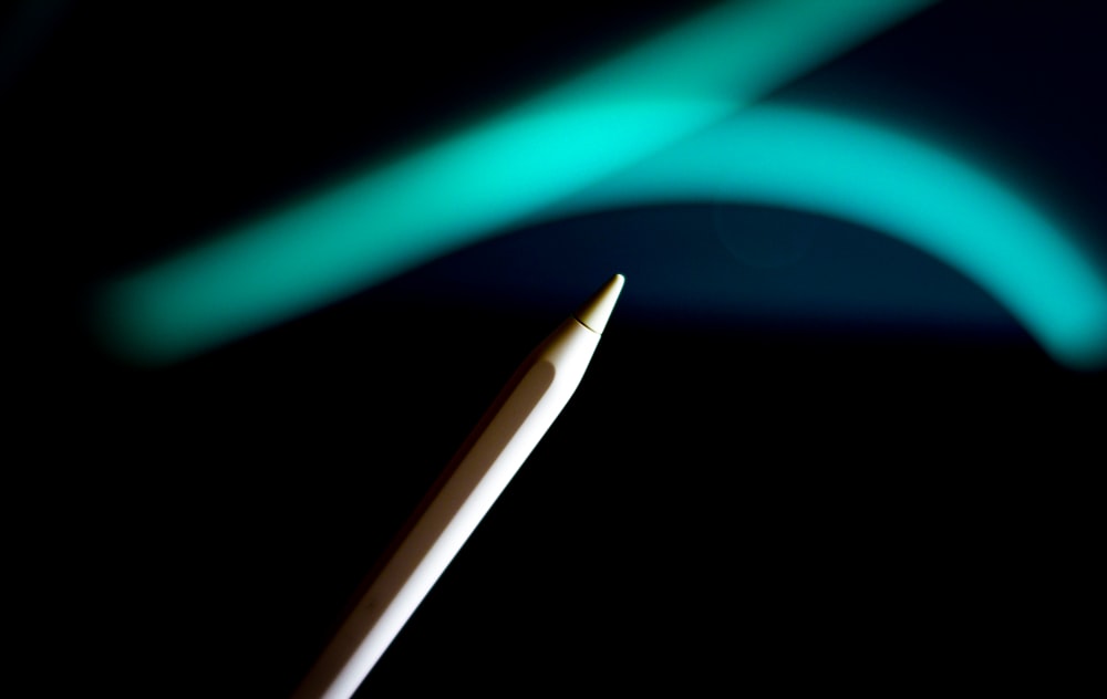 a close up of a toothbrush with a blurry background