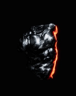 A dark, abstract image featuring a sculpture-like object with a glossy surface. The words 'bruised' and other text elements appear scattered across its surface. Bright red light creates a glowing edge along the right side, contrasting with the overall dark and monochrome tones.