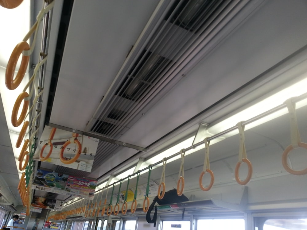 a row of hanging donuts on a train