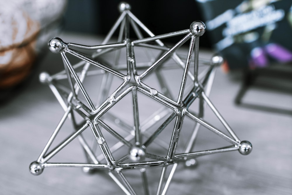a metal model of a star on a table