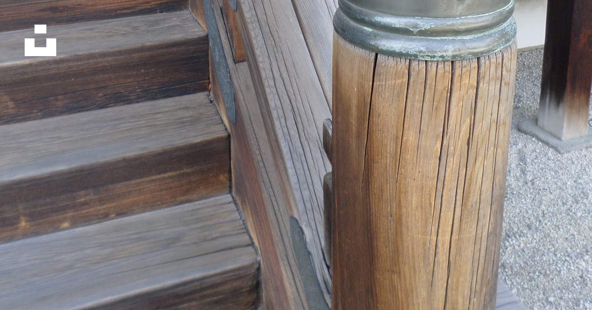 A close up of a wooden railing with a metal top photo – Free Japan ...