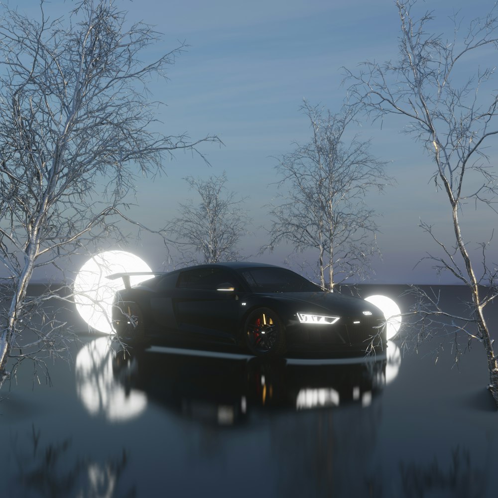a black sports car parked in front of some trees