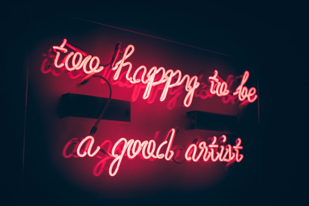 a neon sign that says happy to be a good artist