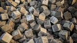 A close-up of heavy cement blocks in different sizes.