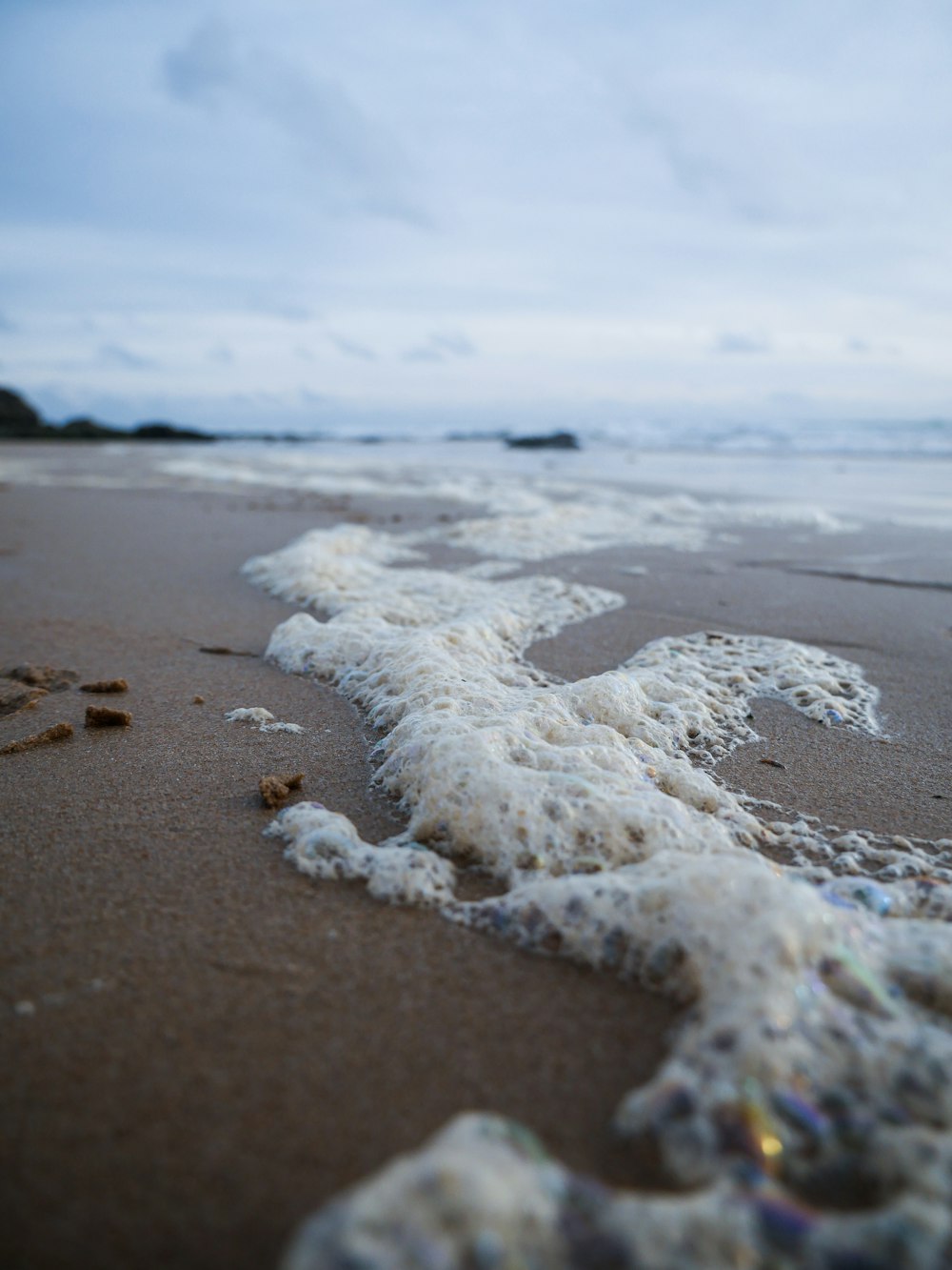 a close up of a wave on a beach