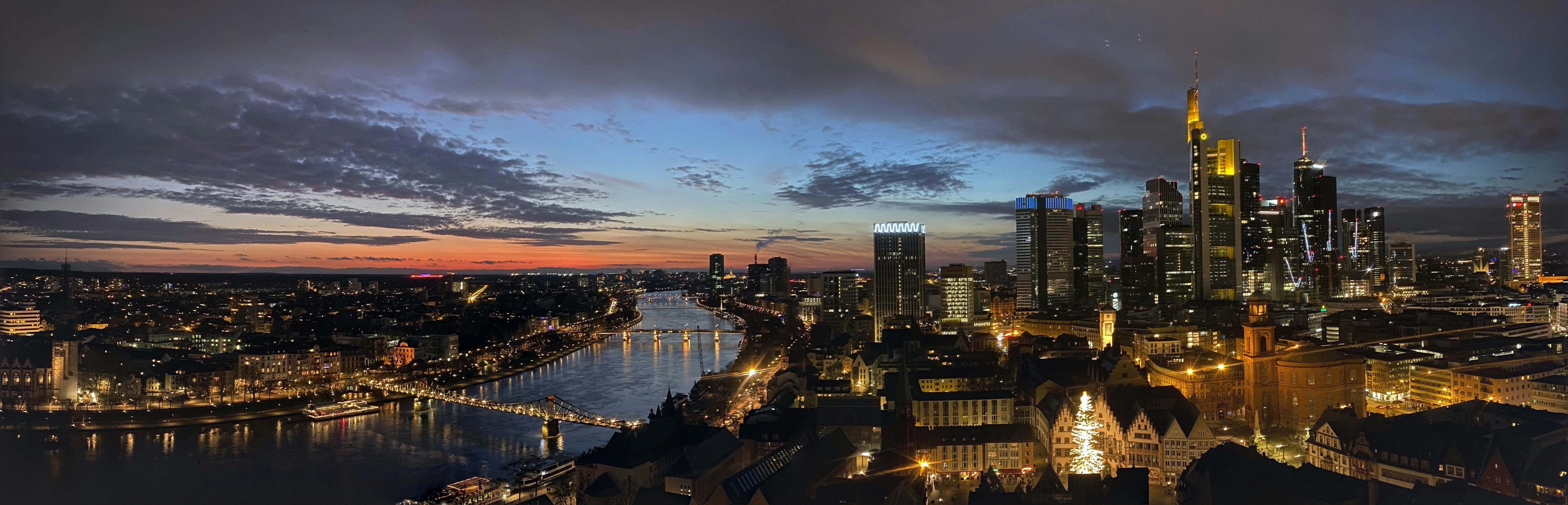 a view of a city at night from the top of a building