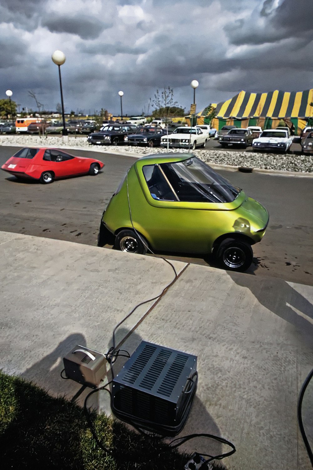 a small car is parked in a parking lot