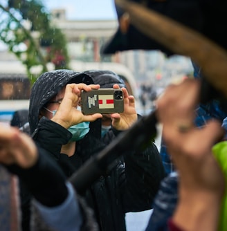 a woman taking a picture of herself with her cell phone