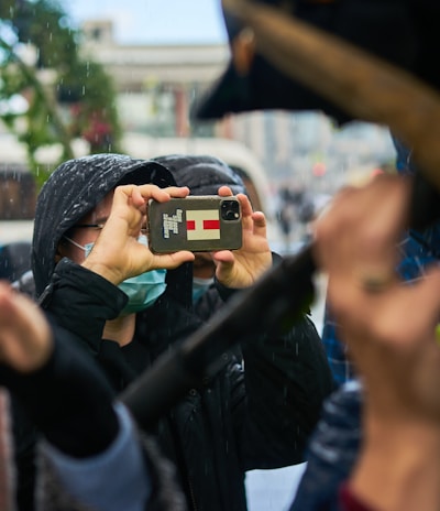 a woman taking a picture of herself with her cell phone