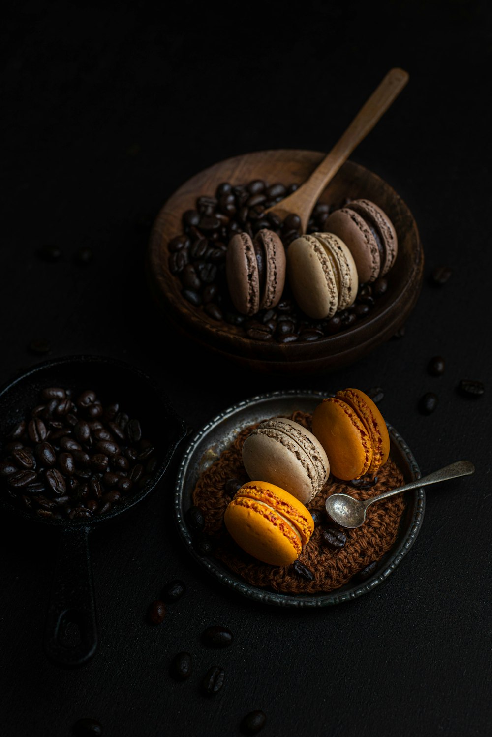 a plate of macaroons and coffee beans