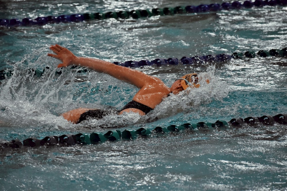 a person swimming in a swimming pool