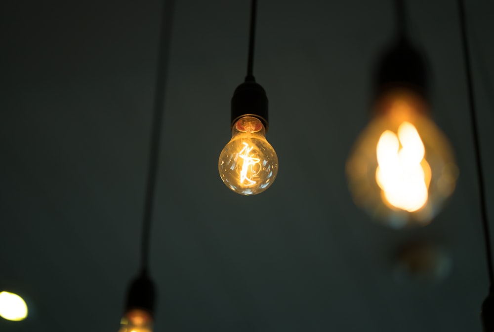 a group of light bulbs hanging from a ceiling