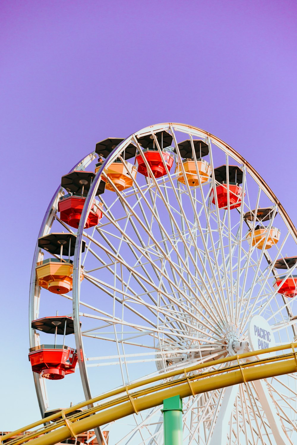 a ferris wheel with red and black seats