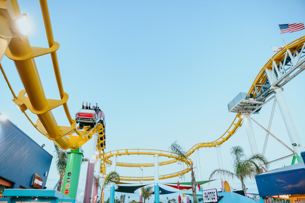 a roller coaster at an amusement park during the day