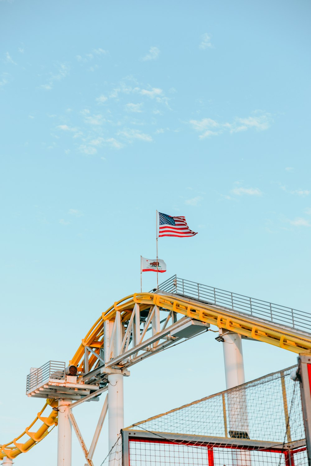 a roller coaster with a flag on top of it