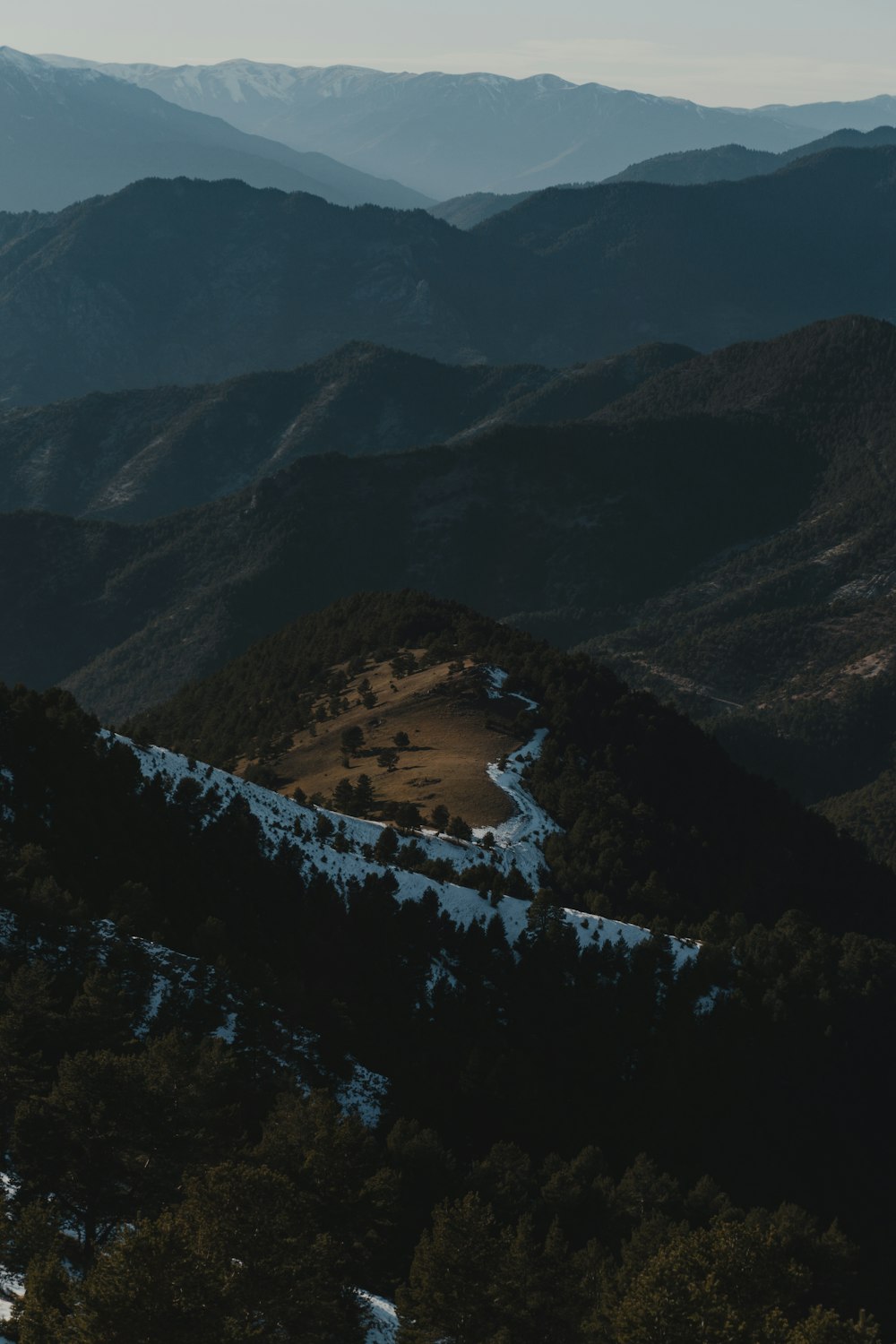 a view of a mountain range covered in snow