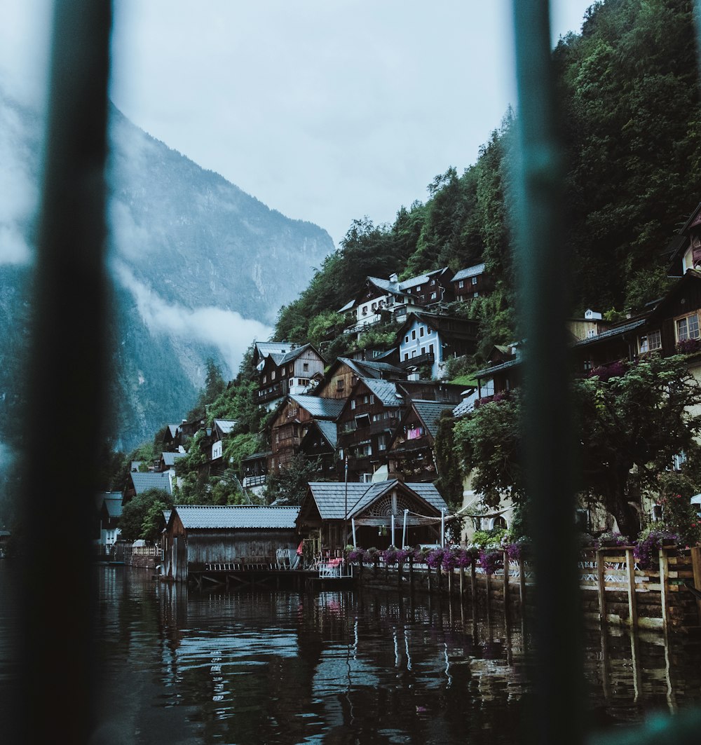 a view of a mountain village from a lake