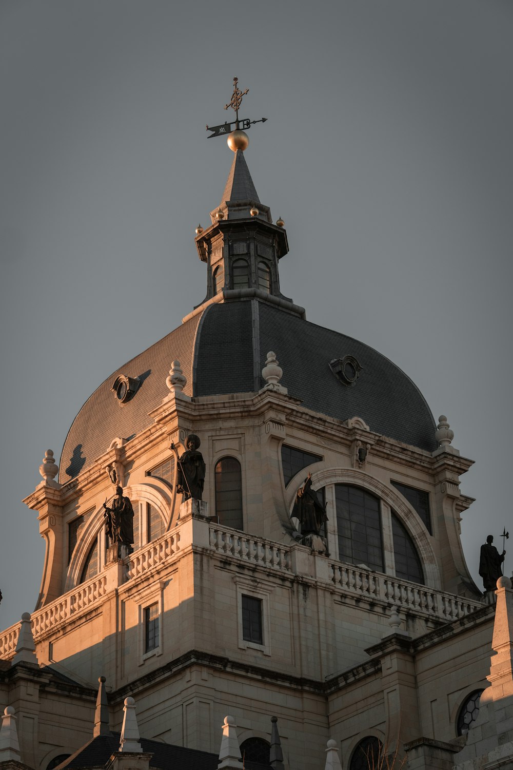 a large building with a steeple and a cross on top