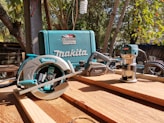 a table with a circular saw and a tool on it