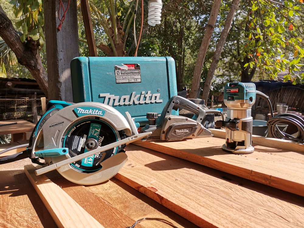 a table with a circular saw and a tool on it