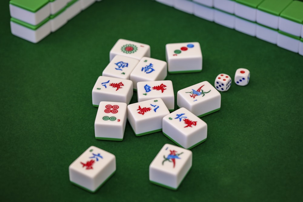 a group of dices sitting on top of a green table