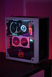 Custom-built gaming PC with colorful RGB lighting on a desk.