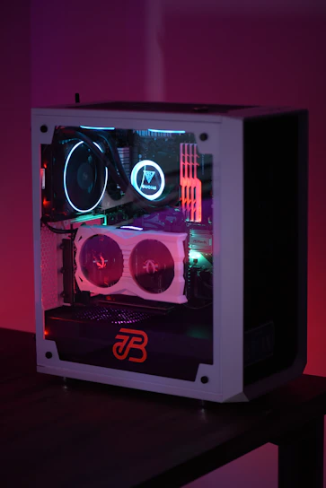 A sleek gaming PC with glowing neon purple and blue lights inside a transparent case.