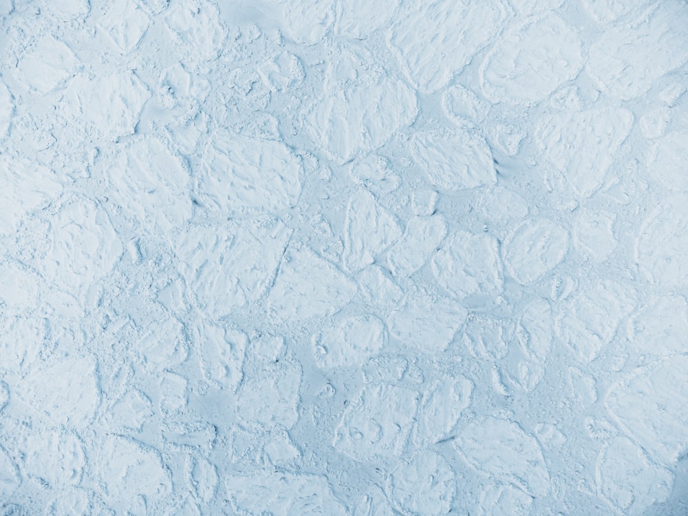 a close up of a blue and white textured background