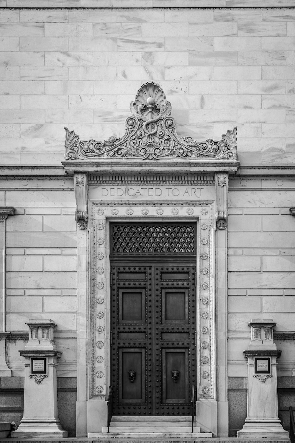 a black and white photo of a large door