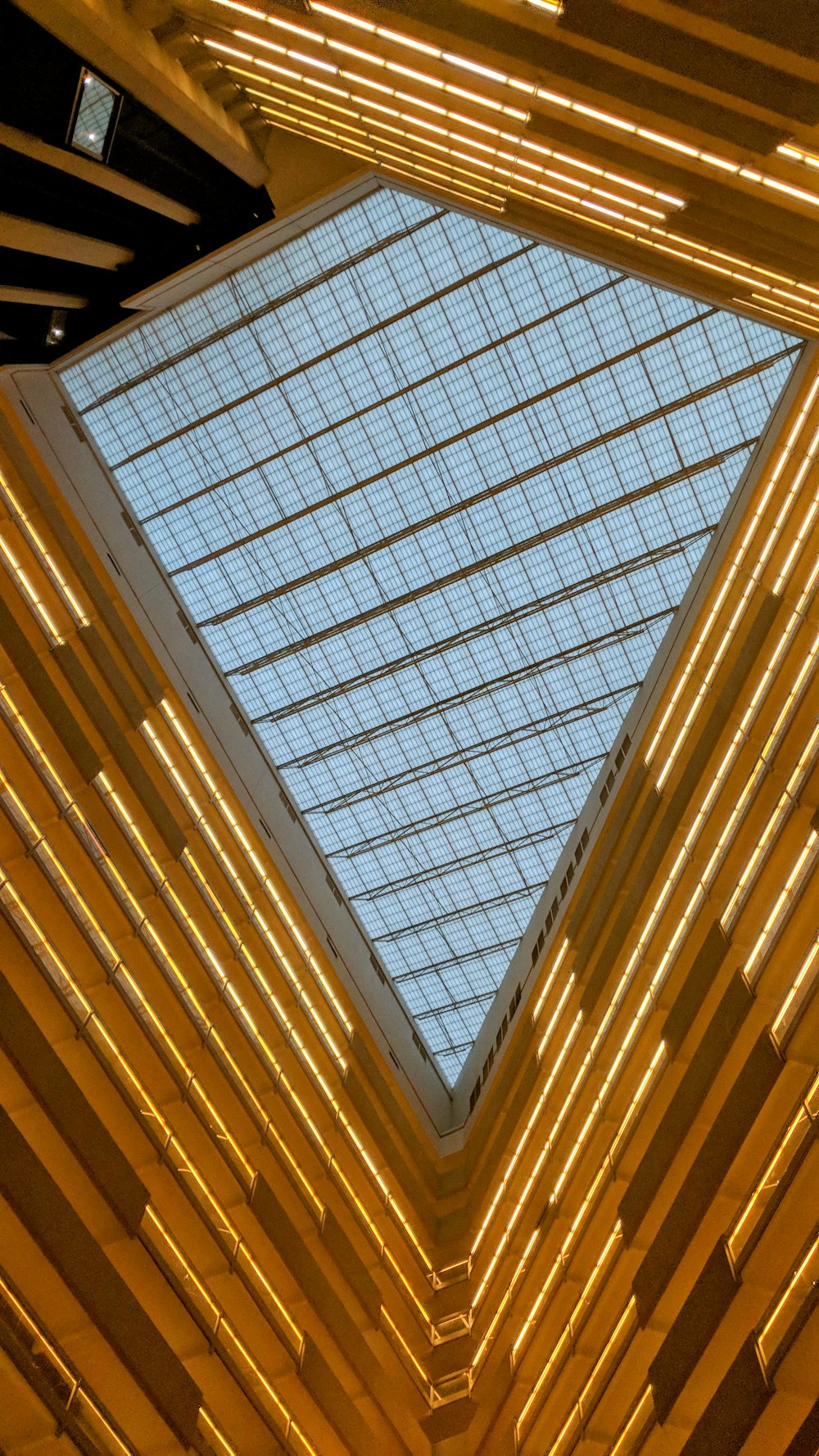 the ceiling of a building with a glass roof