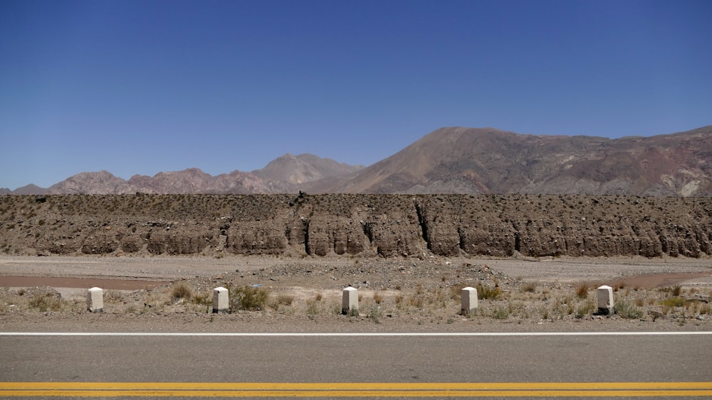 a desert landscape with mountains in the background